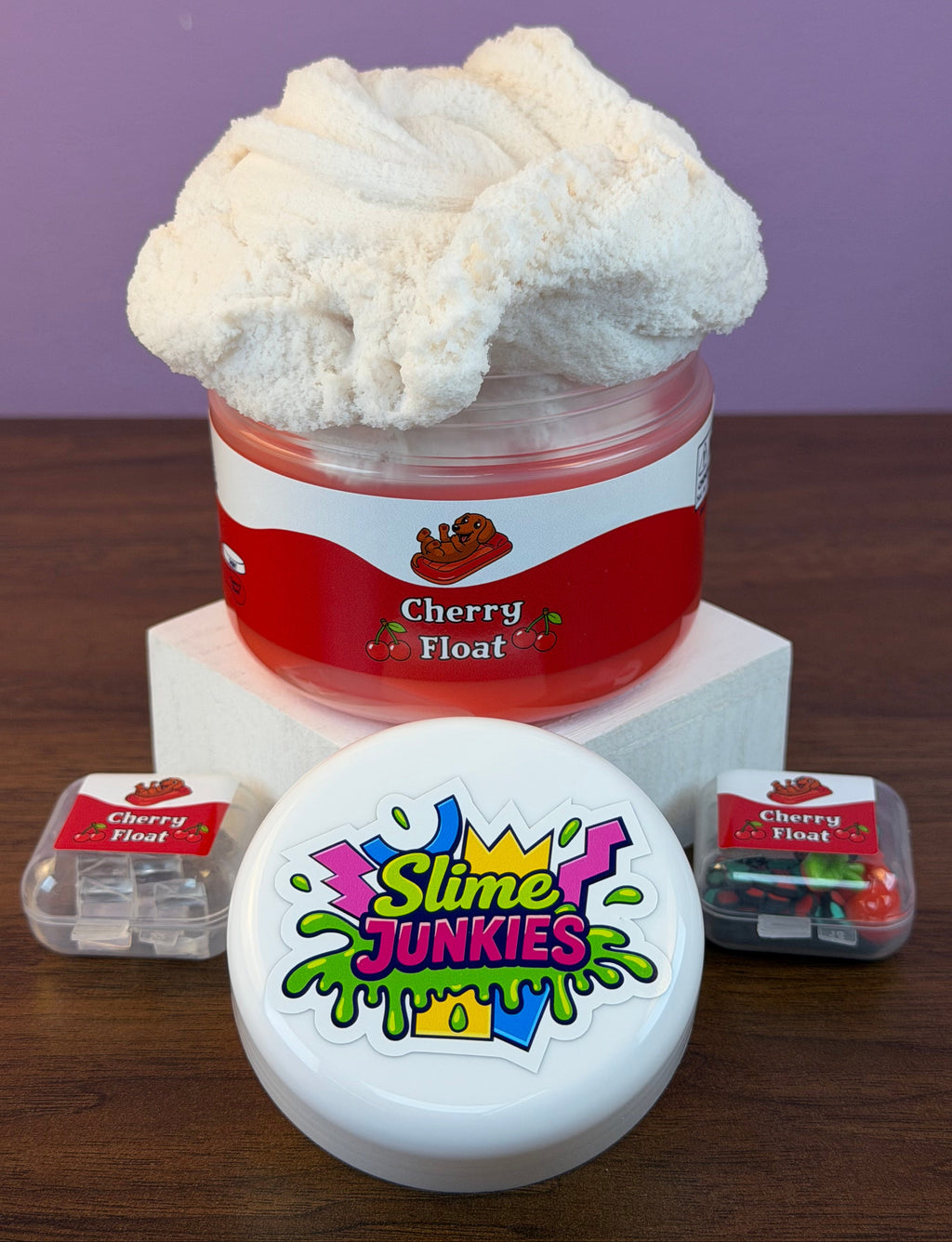 red coated clear slime with white cloud slime with cherry charm with fake cherry sprinkles and fake ice texture