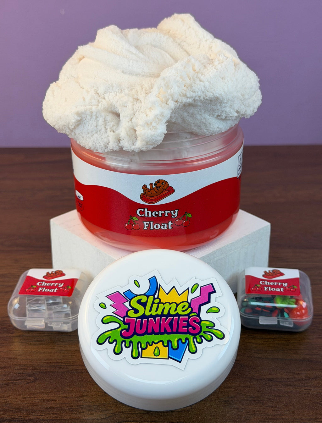 red coated clear slime with white cloud slime with cherry charm with fake cherry sprinkles and fake ice texture