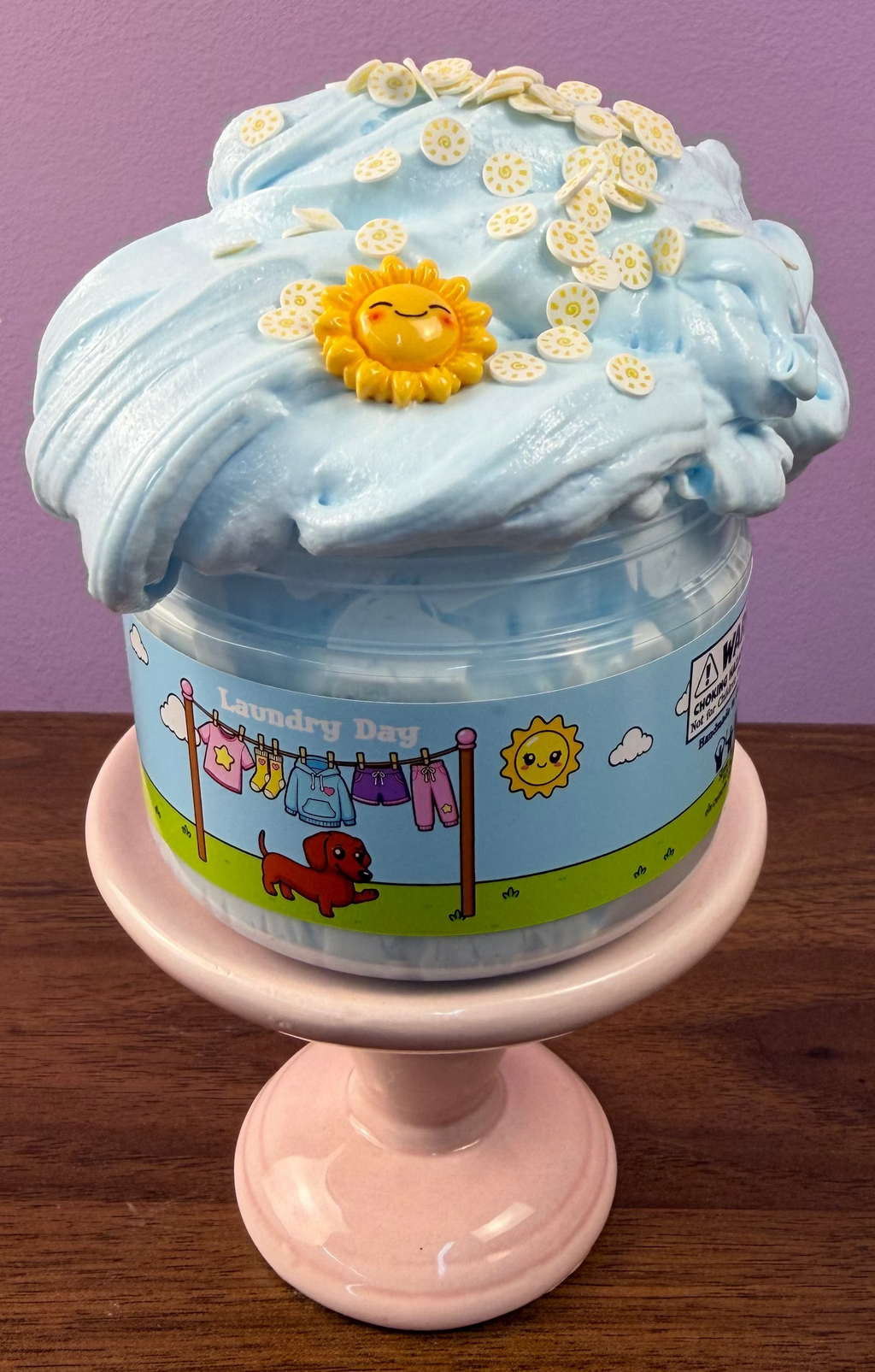 light blue ultra thick slime with sun charm with fake sun sprinkles texture