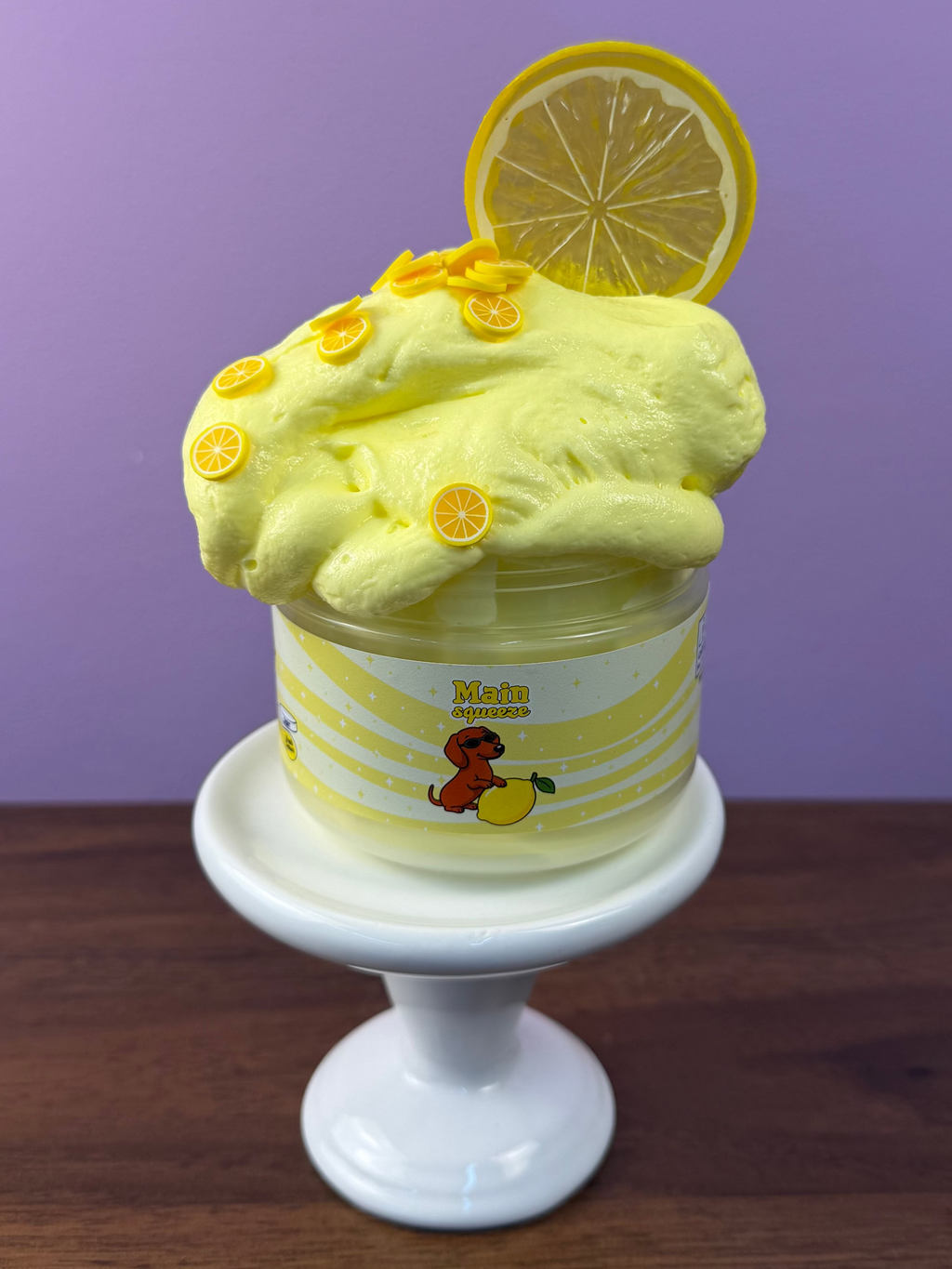 light yellow ultra thick slime with fake plastic lemon slice with fake lemon sprinkles texture