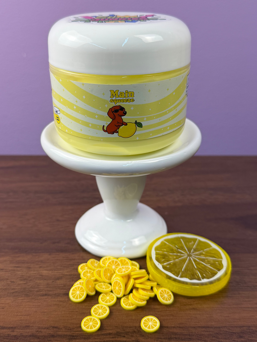 light yellow ultra thick slime with fake plastic lemon slice with fake lemon sprinkles texture