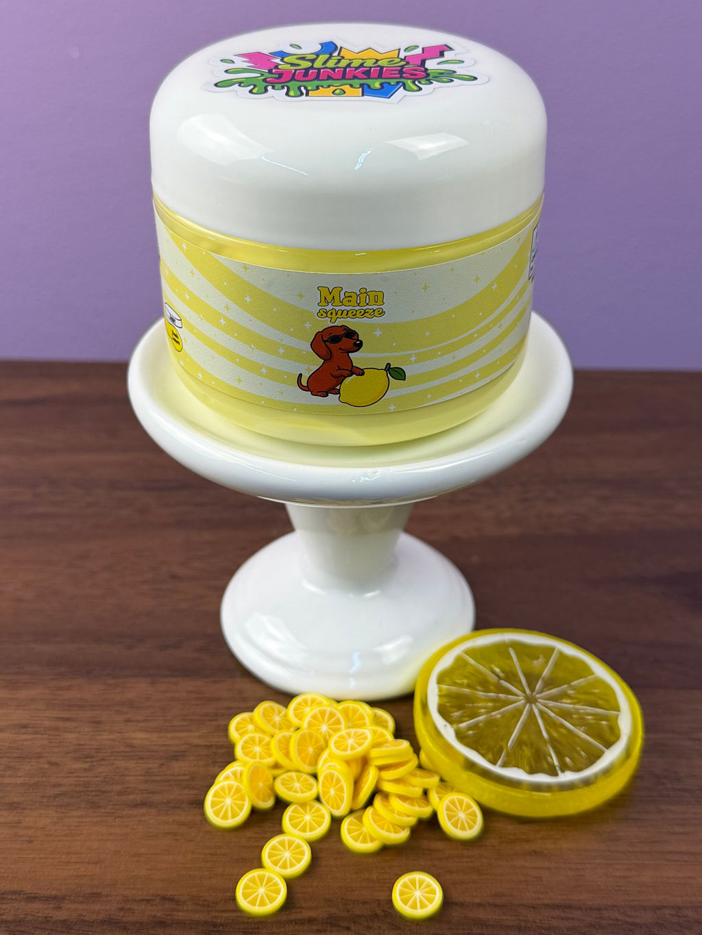 light yellow ultra thick slime with fake plastic lemon slice with fake lemon sprinkles texture