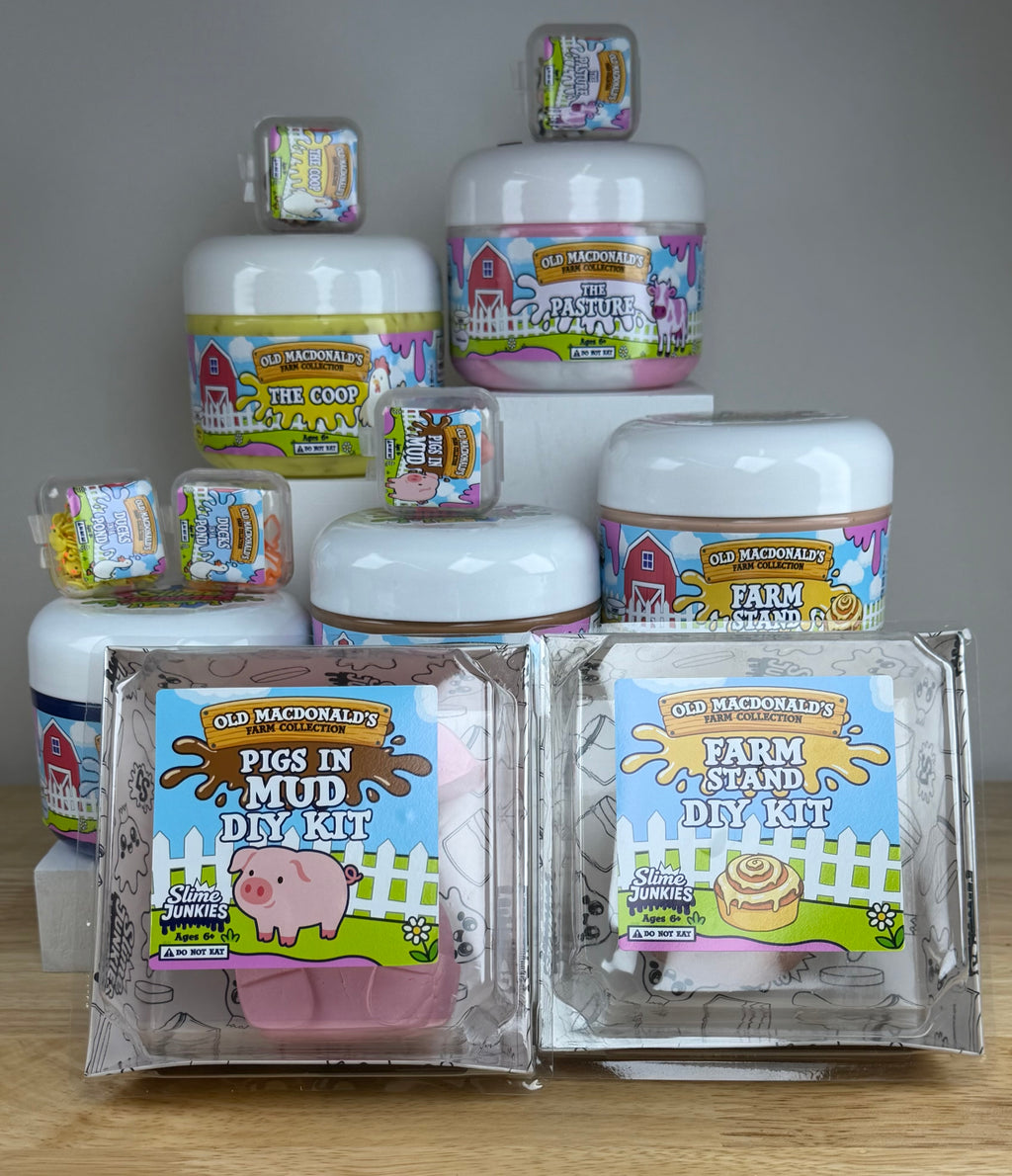 a collection of old macdonald slimes the coop, the pasture, farm stand, pigs in mud, and ducks on a pond all in clear jars with farm labels and animals to represent each label.