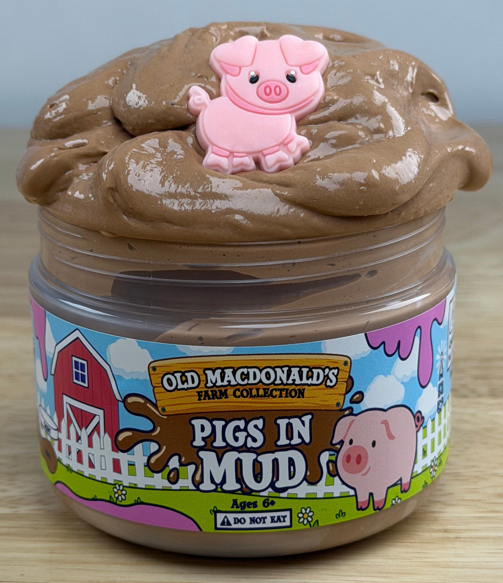 brown slime with a pig charm in a clear jar with an old macdonald farm collection farm label with a pig on it