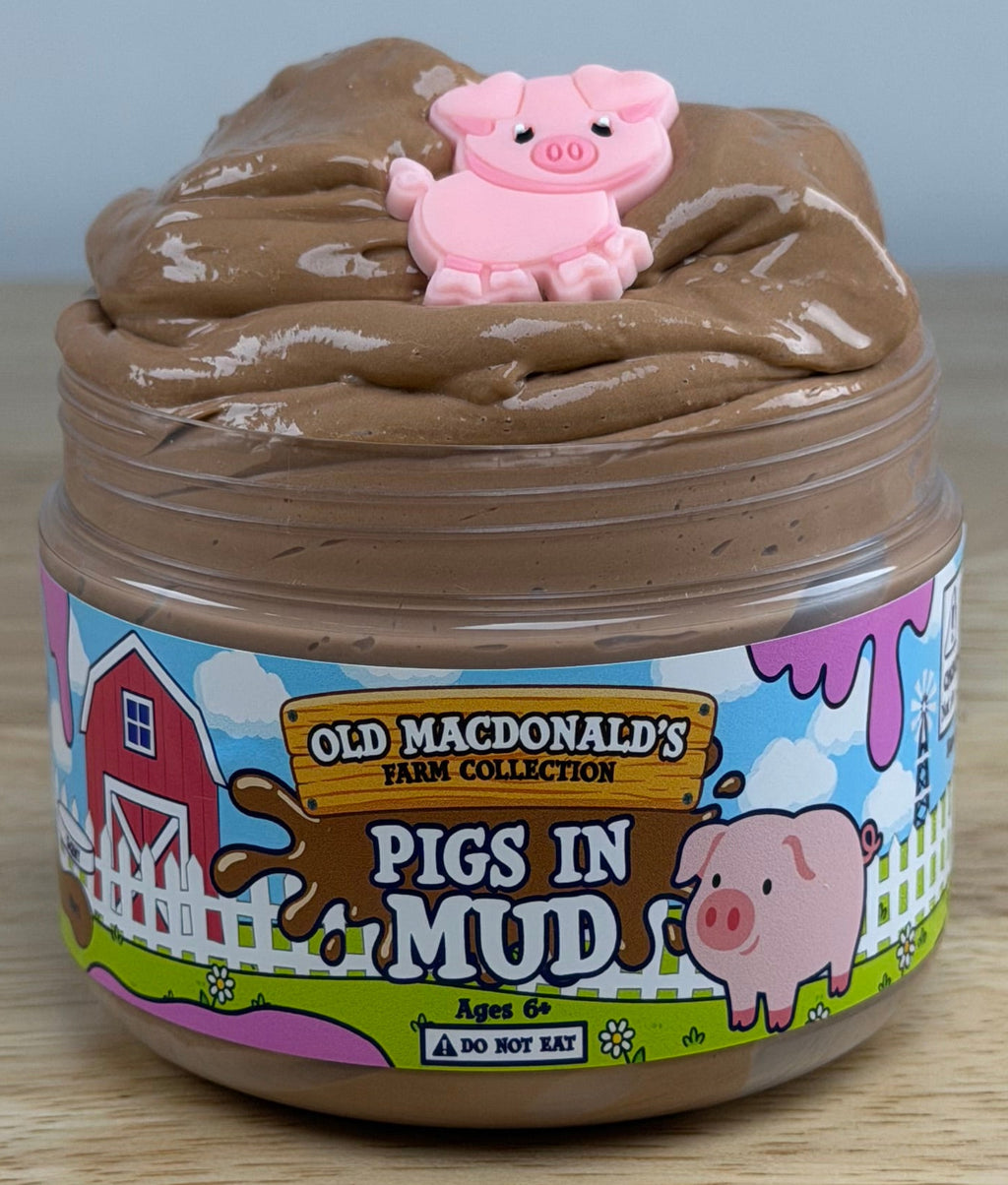 brown slime with a pig charm in a clear jar with an old macdonald farm collection farm label with a pig on it