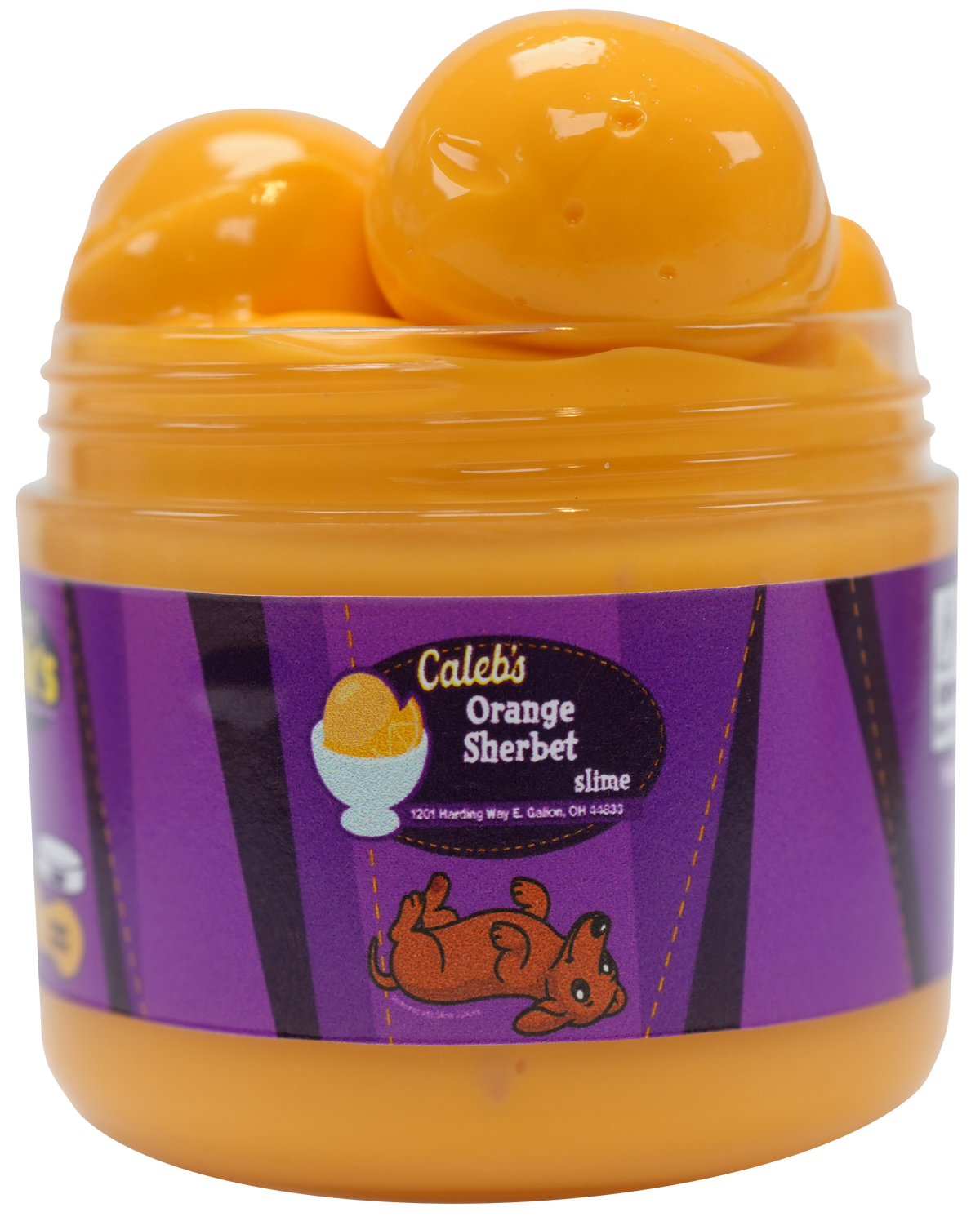orange slime in a jar with a purple label with the name caleb's on it with a bowl of ice cream and a dog