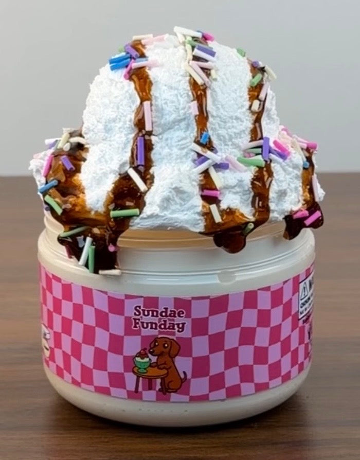 white thick n glossy slime with white clay topper with brown coated clear syrup topper with fake clay sprinkles